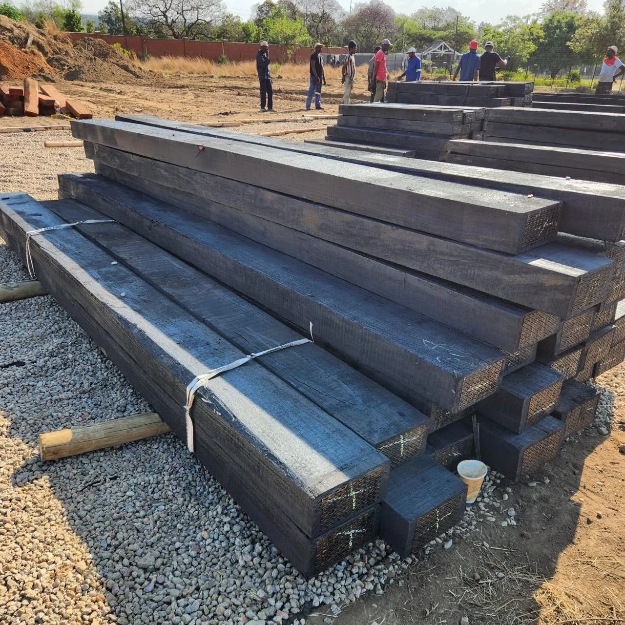 Long stack of treated hardwood sleepers