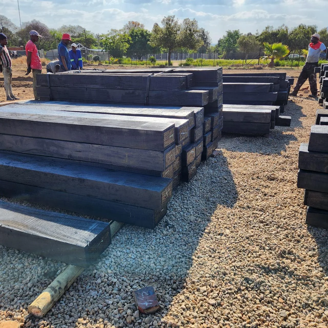 Treated hardwood sleepers open yard stack